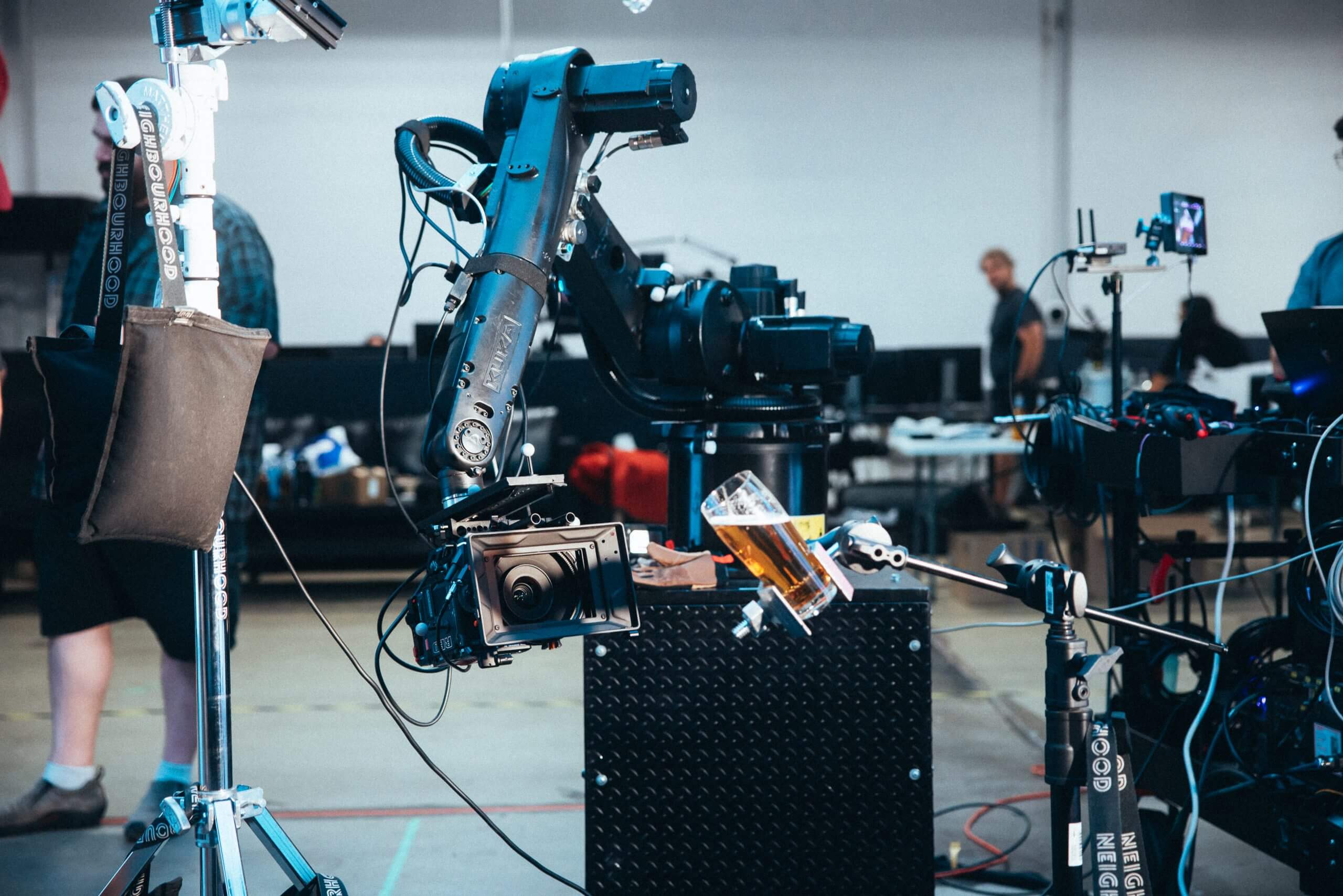 Robot arm motion control camera with mug of beer